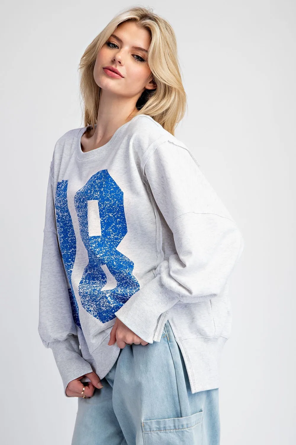 Faded varsity print long sleeve pullover top